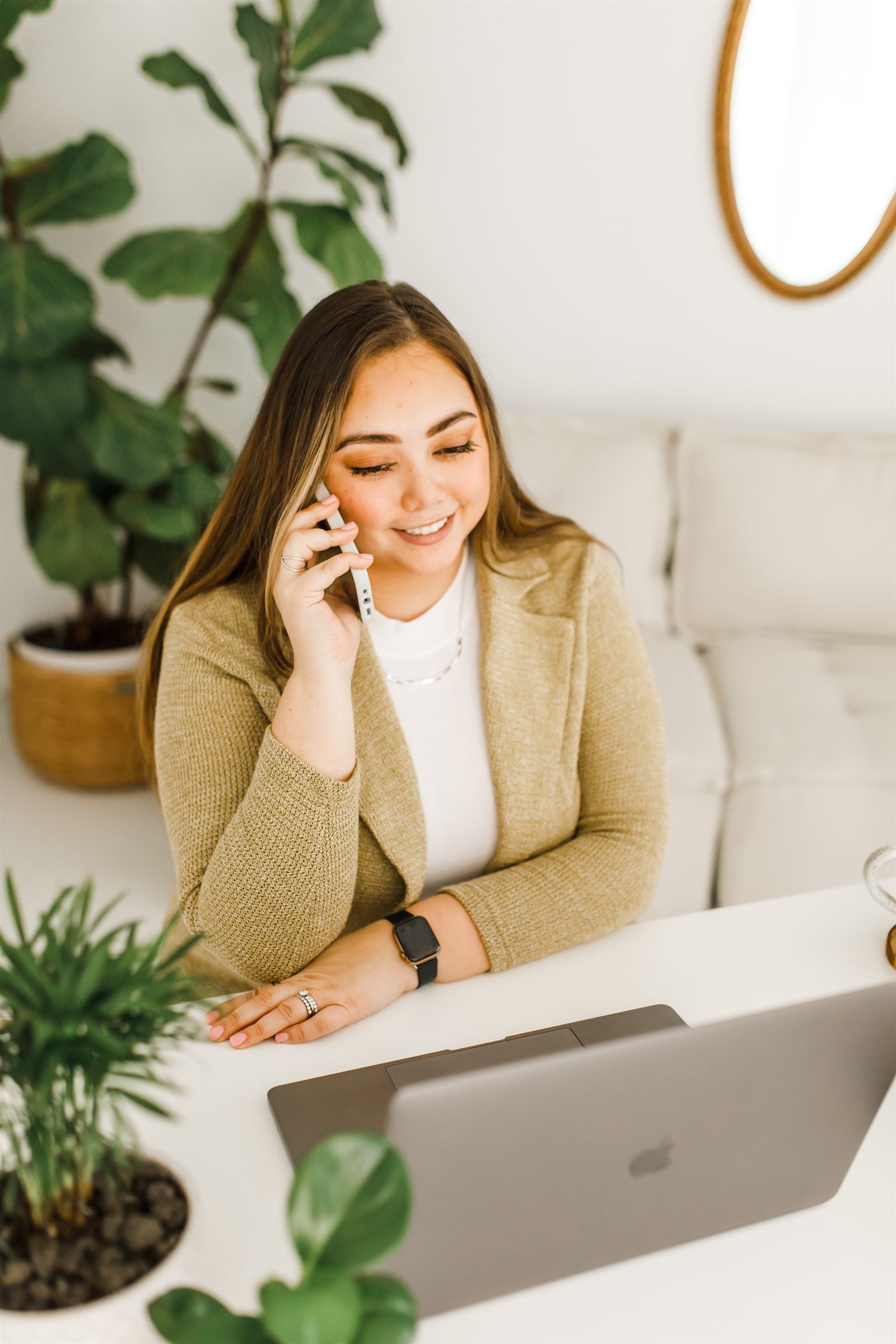 Courtney Mickles, LMFT and LPCC, taking a phone call at her Roseville therapy office — warm, approachable, available to new clients